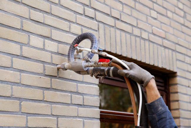 House,Being,Insulated,By,Injecting,Microbead,Pearls,In,The,Cavity