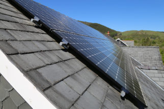 A,View,Of,A,Solar,Panel,On,A,Slate,Roof