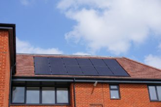Roof,Top,With,Solar,Cells.,Solar,Panels,On,Residential,Block